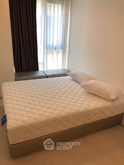 Cozy bedroom with natural light and modern furnishings