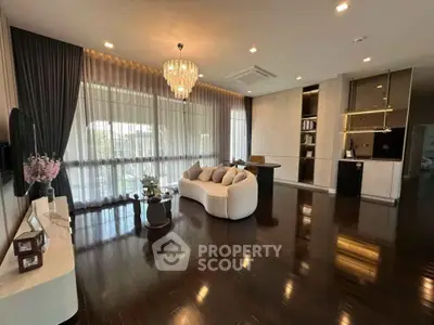 Luxurious living room with elegant chandelier and modern decor