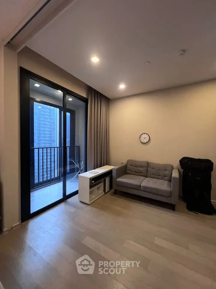 Modern living room with balcony view in urban apartment
