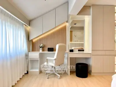 Modern study room with sleek desk, ergonomic chair, and ample storage in a bright, airy space.