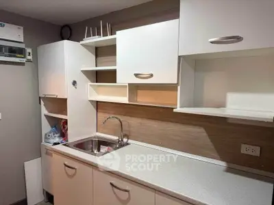Modern kitchen with sleek cabinets and stainless steel sink