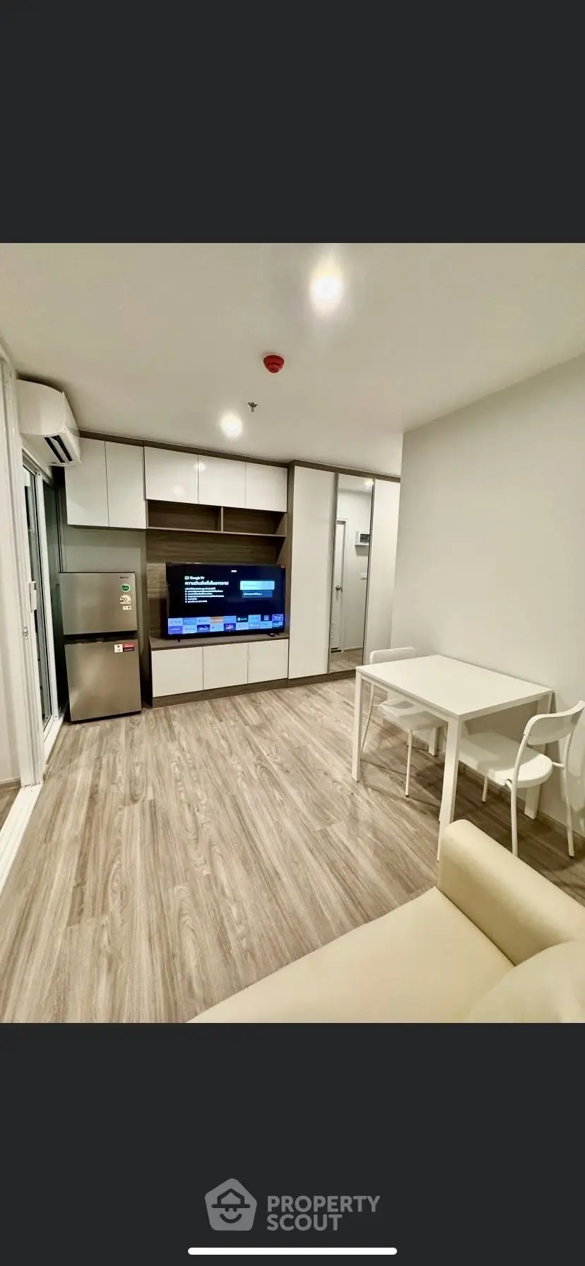 Modern living room with sleek design, featuring open layout and stylish furniture, perfect for urban living.