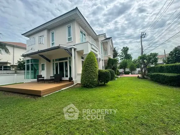 Elegant two-story house with spacious garden and modern patio in a serene neighborhood.