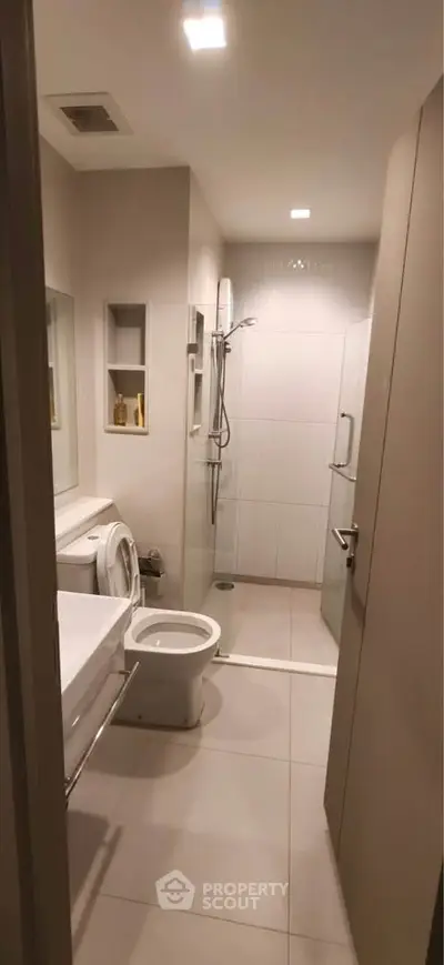 Modern bathroom with sleek design and glass shower enclosure