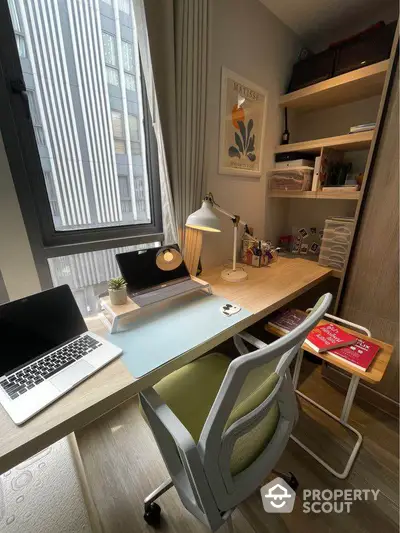 Modern study room with sleek desk, laptop, and stylish decor in urban apartment