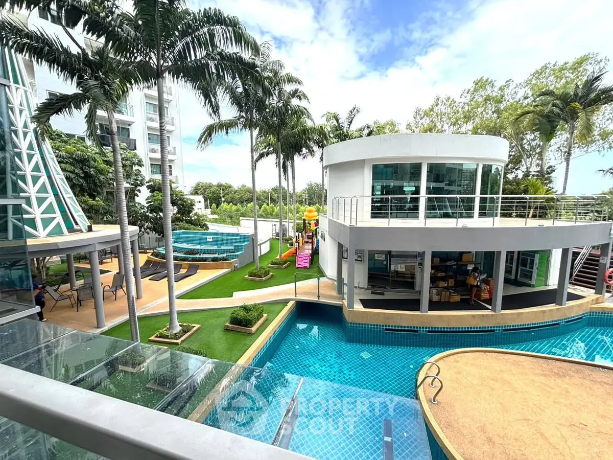 Luxurious condominium with pool, lush greenery, and modern architecture for resort-style living.