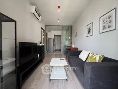 Modern living room with sleek furniture and air conditioning in a stylish apartment.