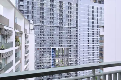 Modern high-rise apartment buildings with balconies and urban view.