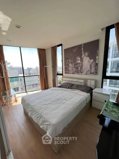 Modern bedroom with city view and stylish decor in high-rise apartment