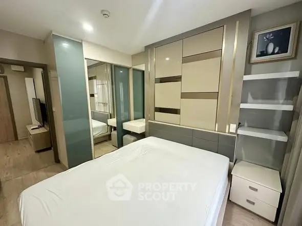 Modern bedroom with sleek design and ample storage space