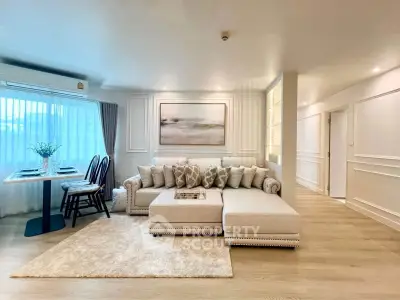 Luxurious living room with elegant decor and spacious seating area in modern apartment.