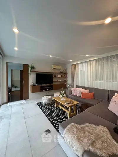 Spacious modern living room with cozy sectional sofa and stylish decor