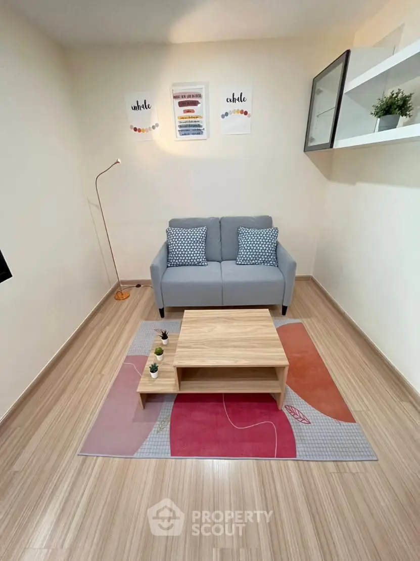 Cozy modern living room with stylish decor and wooden flooring, perfect for relaxation.