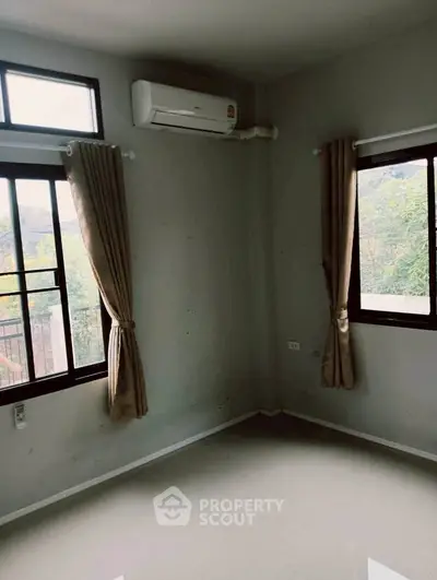 Spacious corner unit with large windows and air conditioning, offering serene views and abundant natural light.