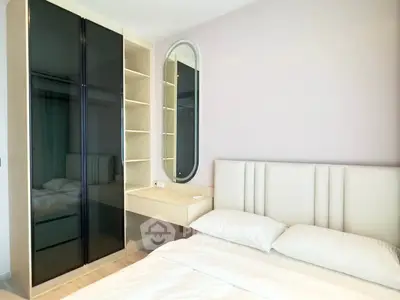 Modern bedroom with sleek wardrobe and elegant decor