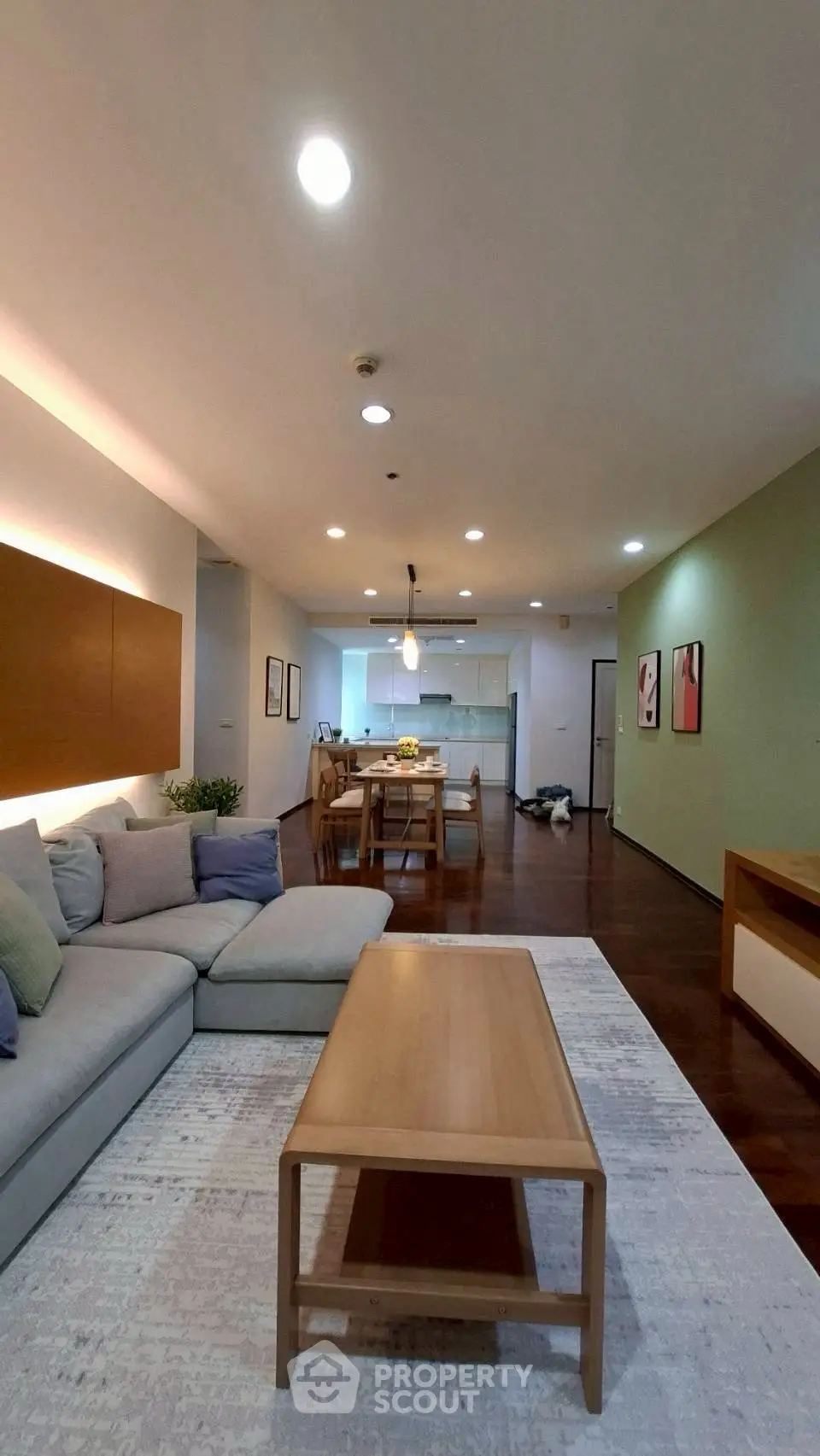Spacious modern living room with open kitchen layout and stylish decor