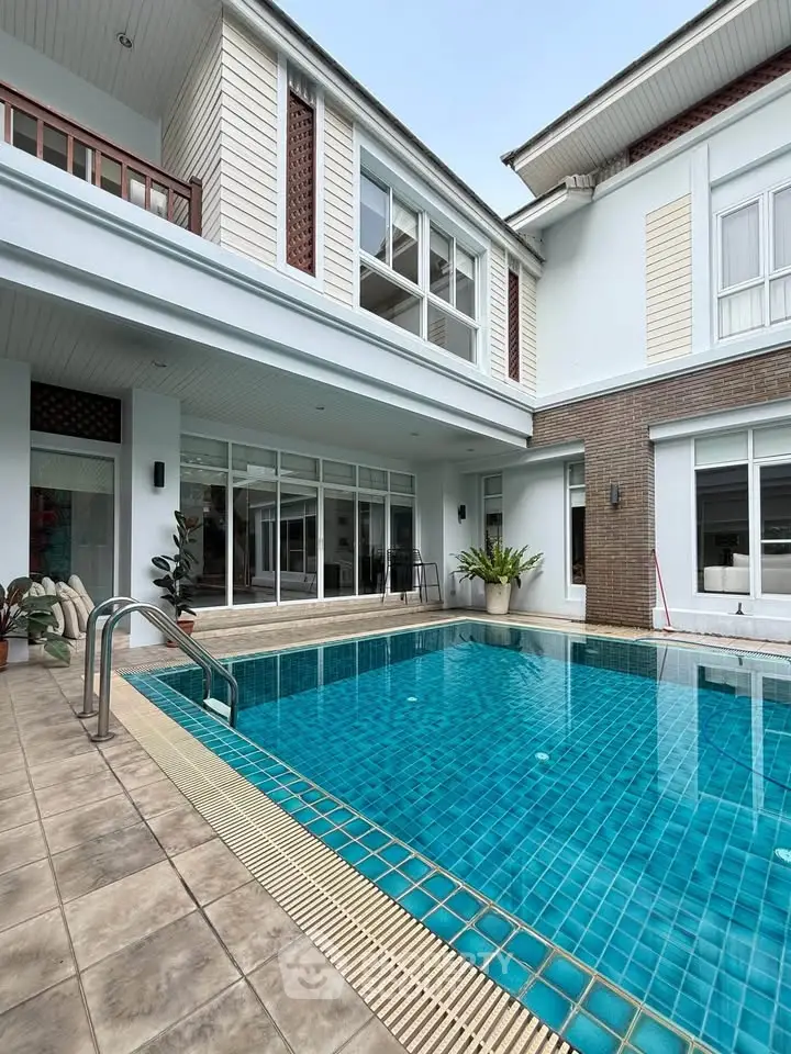 Luxurious modern home with a stunning private pool and elegant exterior design, perfect for relaxation and entertainment.