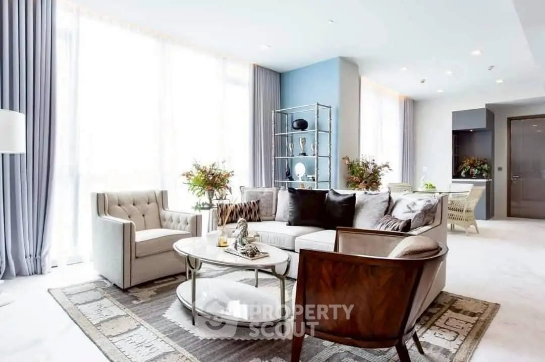 Luxurious living room with elegant furniture and large windows, perfect for modern living.