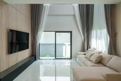 Spacious modern living room with high ceilings and elegant decor