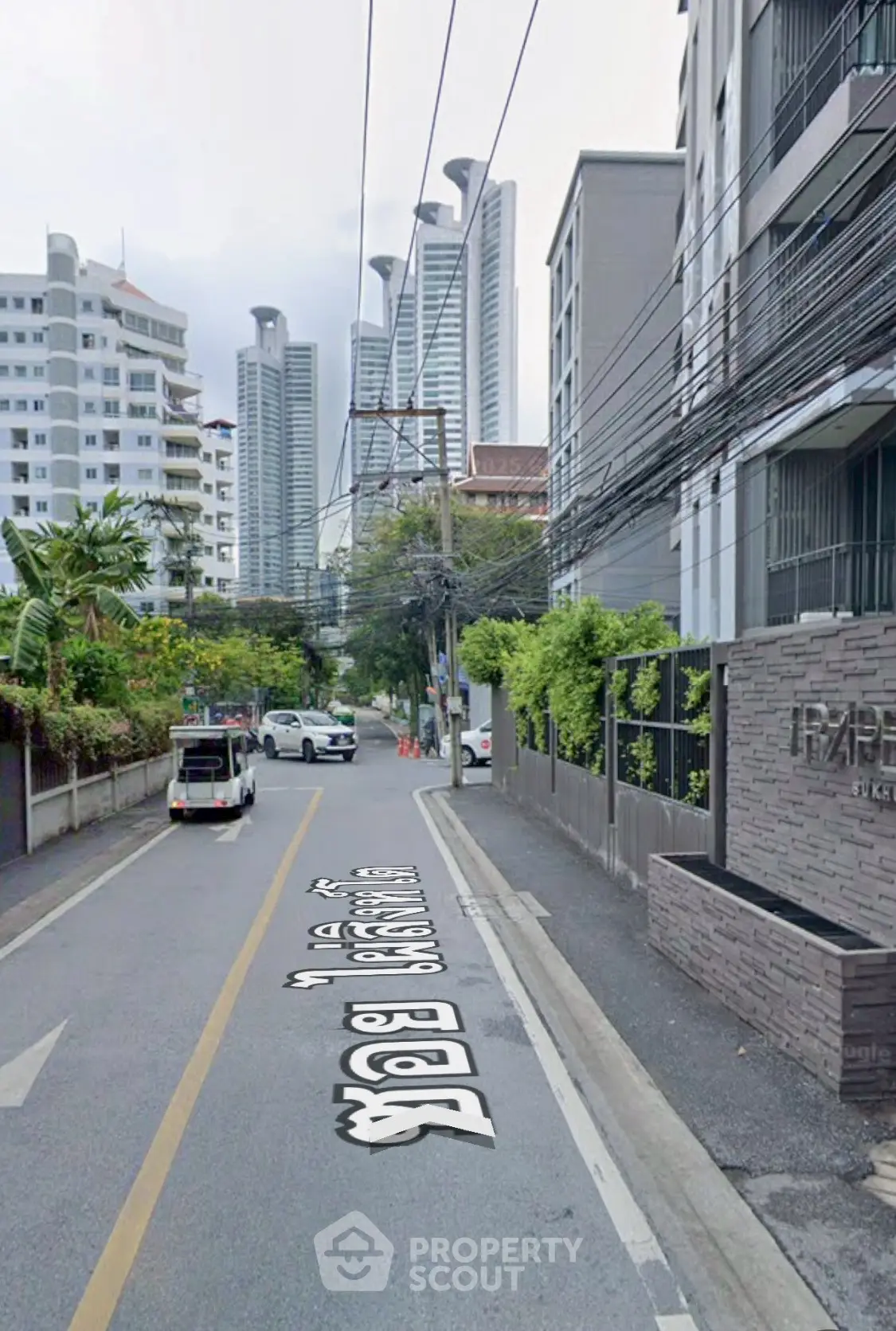 Urban street view with modern high-rise buildings and residential area