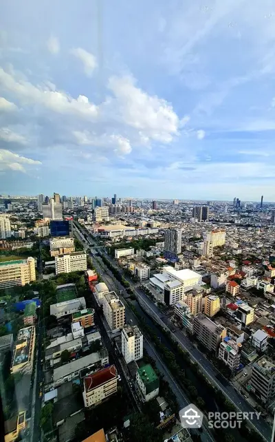 Stunning panoramic cityscape view from high-rise building showcasing urban skyline and vibrant city life.