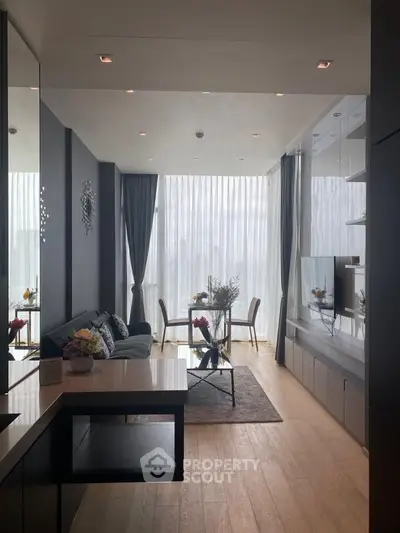 Luxurious modern living room with floor-to-ceiling windows and elegant decor