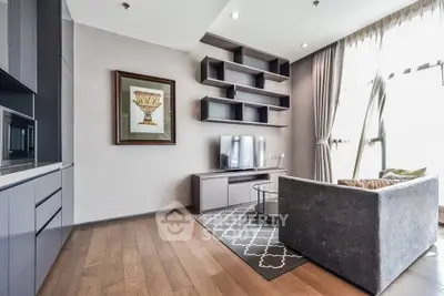 Modern living room with stylish shelving and large windows in a contemporary apartment.
