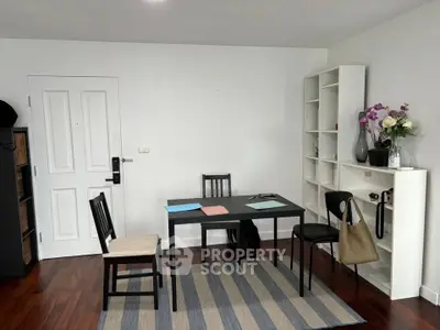 Modern study room with sleek furniture and hardwood floors, perfect for productivity and style.