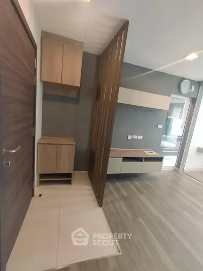Modern apartment interior with stylish wooden partition and sleek cabinetry