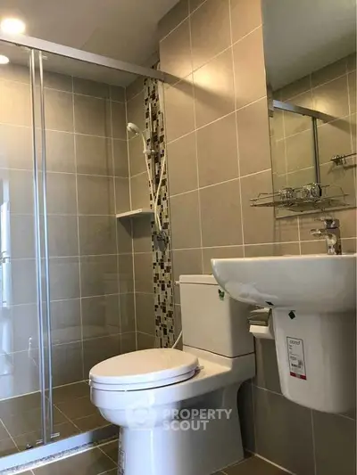 Modern bathroom with glass shower and sleek fixtures