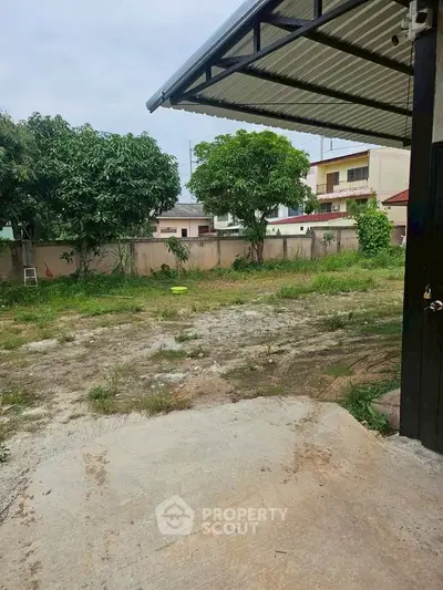 Spacious backyard with potential for landscaping in suburban home