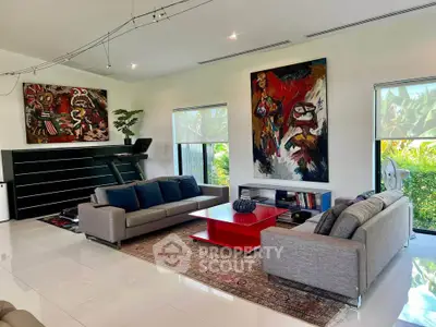 Spacious modern living room with stylish decor and large windows