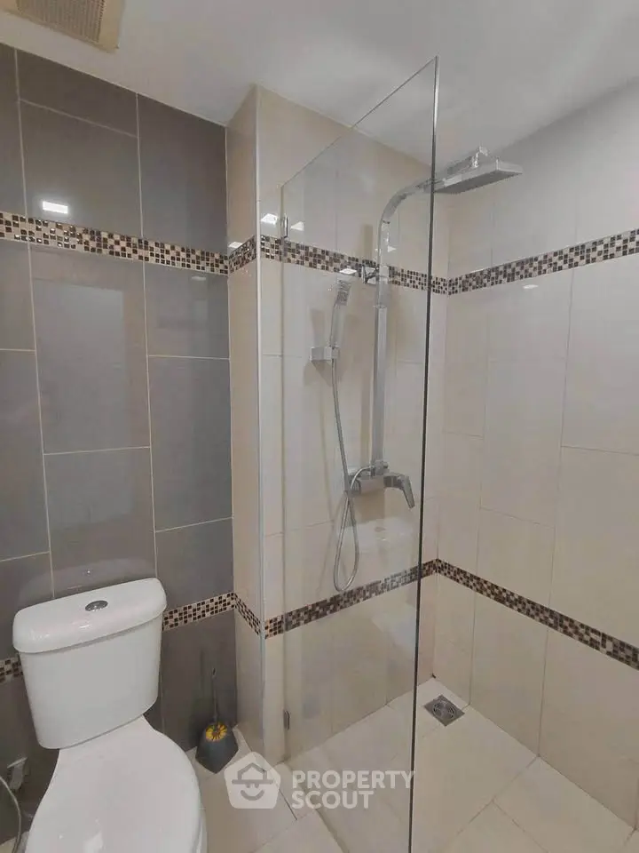Modern bathroom with sleek shower and elegant tile design