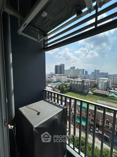 High-rise balcony with cityscape view, showcasing urban living and skyline.