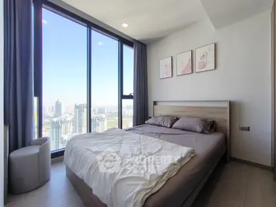 Modern bedroom with panoramic city view and stylish decor
