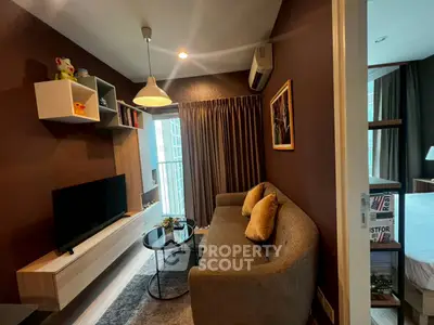 Cozy living room with modern decor and natural light in a stylish apartment