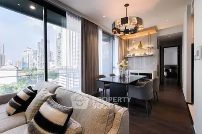 Luxurious modern living room with city view, elegant dining area, and stylish decor in high-rise apartment.