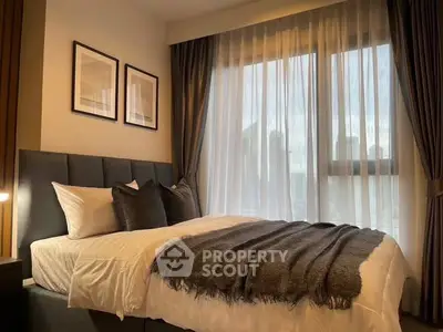 Cozy bedroom with elegant decor and large window view