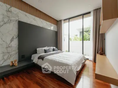 Luxurious modern bedroom with large windows and elegant decor