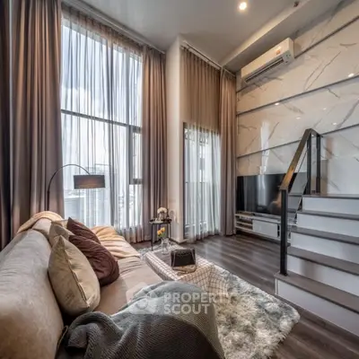 Luxurious modern living room with high ceilings and large windows