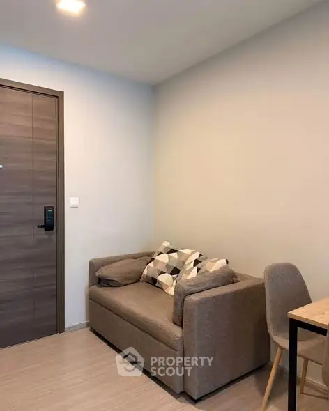 Cozy living room with modern sofa and stylish decor in a contemporary apartment.