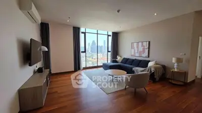 Spacious modern living room with city view, wooden flooring, and stylish furniture.