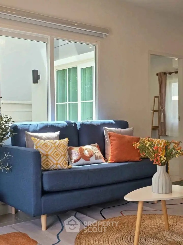 Charming living room with cozy blue sofa and stylish decor