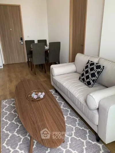 Modern living room with stylish furniture and elegant decor in a cozy apartment setting.