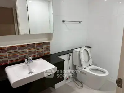 Modern bathroom with sleek fixtures and stylish tile accents