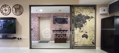 Stylish modern living room with brick accent wall and world map decor