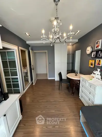 Stylish living room with elegant chandelier and modern decor