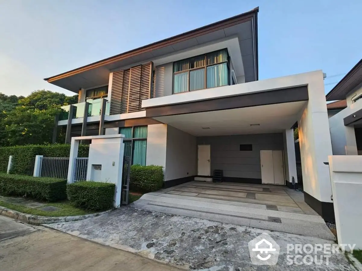 Modern two-story house with spacious driveway and contemporary design