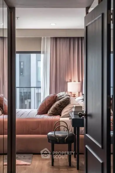 Luxurious bedroom with plush bedding and elegant decor, featuring a large window with city view.