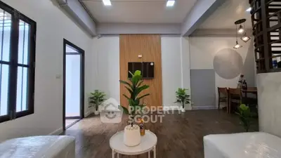 Modern living room with stylish decor and wooden flooring